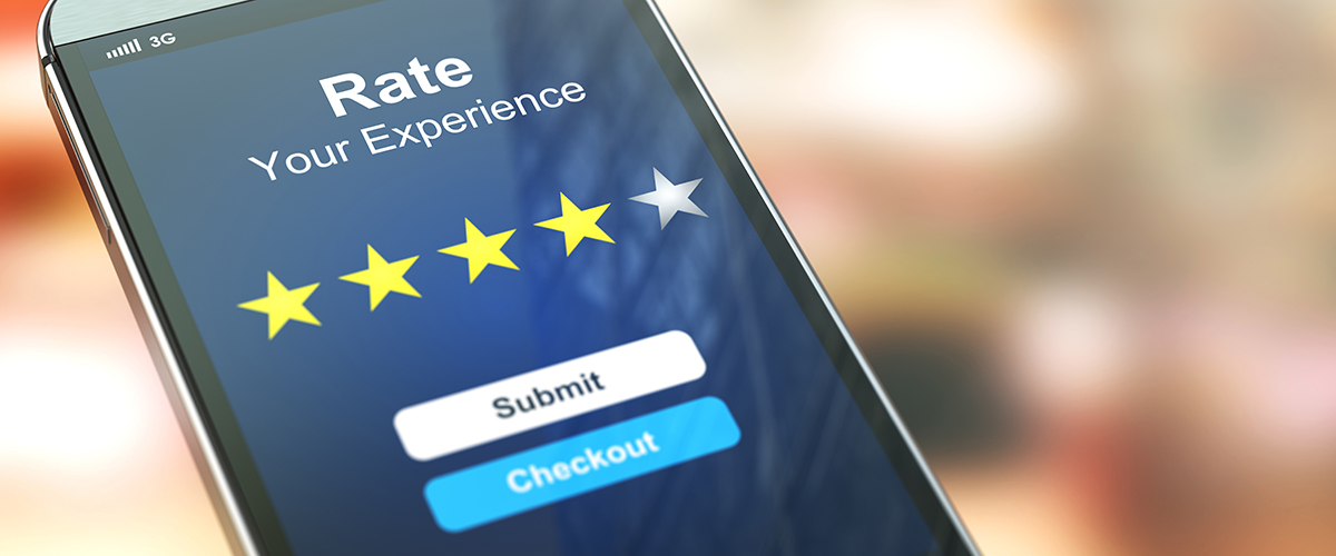Smartphone or mobile phone with text rate your experience on the screen. Online feedback rating and review.