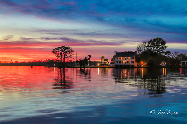Waterfront at sunset with house in the background in Edenton, NC